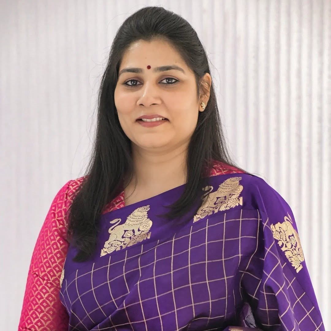 Portrait in a purple saree.